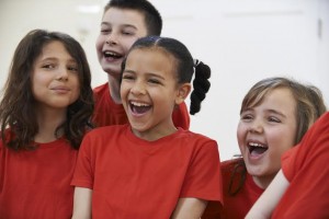 Group Of Children Enjoying Drama Class Together