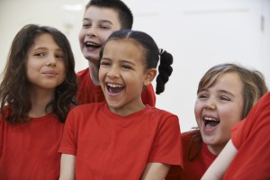 Group Of Children Enjoying Adventure Park Together